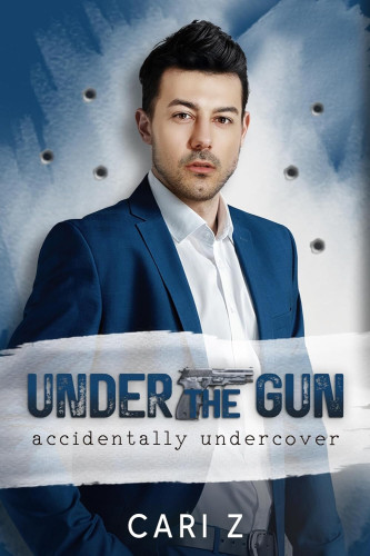 Cover - Under the Gun by Cari Z. - a cute young white man with dark gelled hair and stubble and brown eyes staring at te viewer, weating an open collar white button down shirt and deep ble jacket, in front of a light blue wall peppered with bullet holes