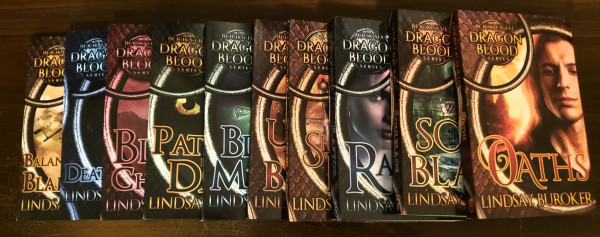 The ten books of the Dragon Blood series by Lindsay Buroker, laid out overlapping with part of each front cover revealed