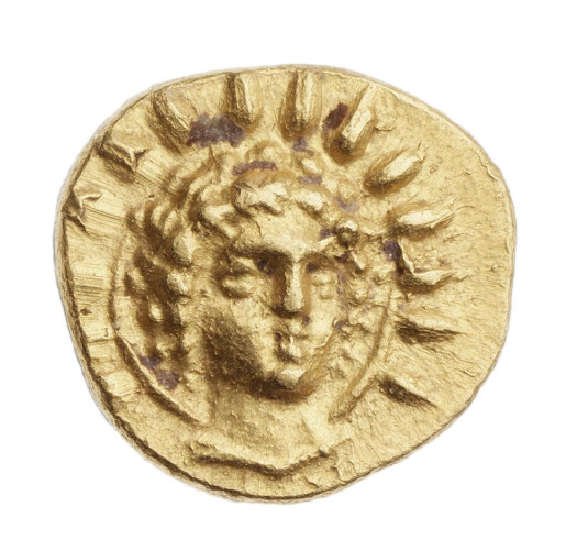 Golden coin with the radiate head of Helios facing the onlooker.