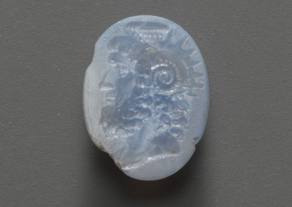 This intaglio is nearly translucent white with a light blue undertone. Jupiter Ammon is shown in portraiture style facing the left.