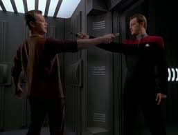 Maquis Tom Paris and Starfleet Tom Paris holding phasers at each other
