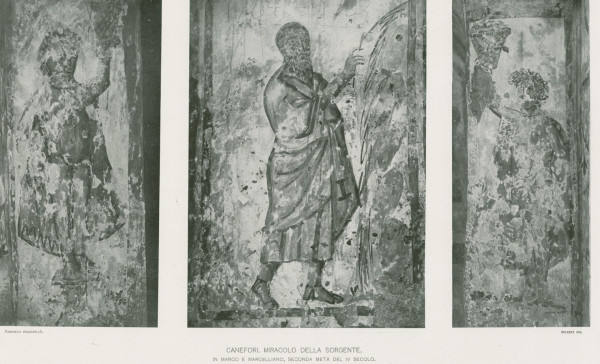 On the left is a painted female figure holding a basket aloft. In the center an older man dressed in a pallium and tunic holds a staff and strikes a rock. Water is coming out of the rock. On the right, another female figure similar to the one the left.