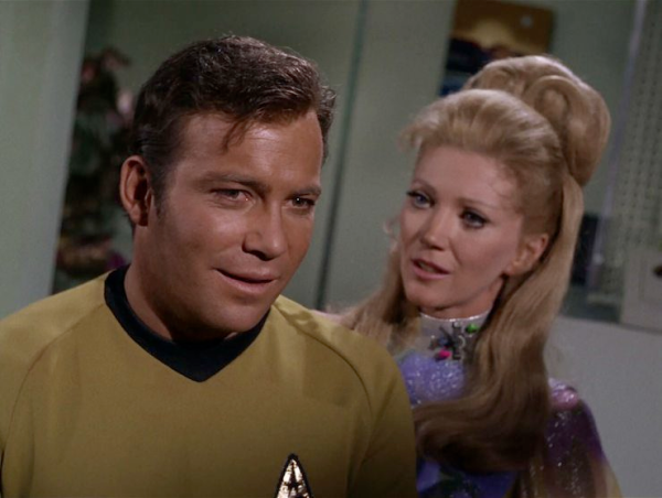 Kirk with the hot alien who has big hair.