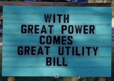 Sign saying "With great power comes great utility bill"