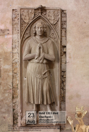 The picture shows a grave slab with a semi-plastic male figure with folded hands.