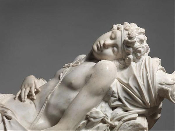 Marble sculpure of Adonis lying dead or dying. His face is serene and no injuries can be seen, so that the onlooker might think he is just asleep.