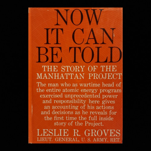 A photo of a hardcover book with solid red dust-jacket, overlayed on a solid black background.

NOW IT CAN BE TOLD

THE STORY OF THE MANHATTAN PROJECT

The man who as wartime head of the entire atomic energy program exercised unprecedented power and responsibility here gives an accounting of his actions and decisions as he reveals for the first time the full inside story of the Project.

LESLIE R. GROVES LIEUT. GENERAL, U. S. ARMY, RET.

The all-caps book title occupies the upper third of the book in a large black serifed typeface.
The all-caps subtitle and author are in a smaller white, same typeface, located below the title and on the penultimate line at the bottom, respectively.
The summary is smaller again, not all-caps, and fills the space between.