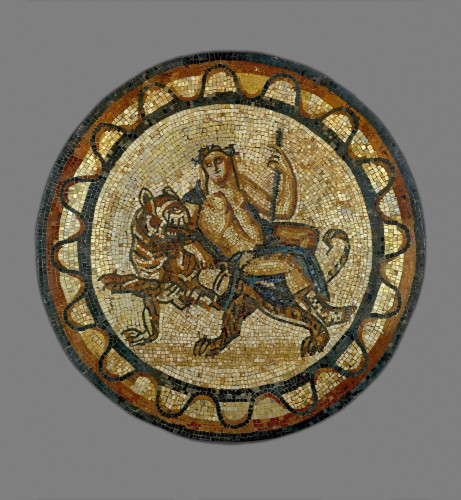 Disc-shaped mosaic of Dionysos reclining on a tigress, holding his thyrsos staff and kantharos cup. The tigress is walking, turning her head to look at her rider.