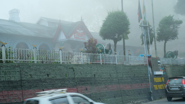 Mist envelops the Assam RIfles outpost in the heart of the city of Aizawl. It's structure is that of the British era, Assam type house.