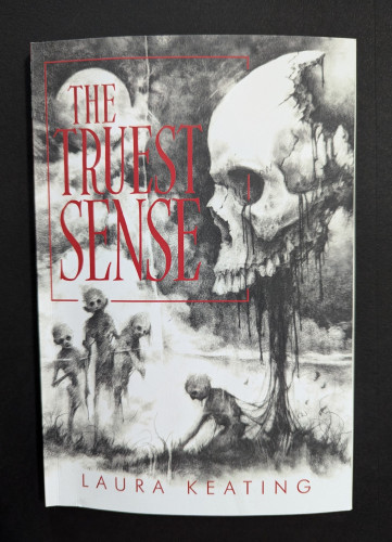 THE TRUEST SENSE by Laura Keating. A large skull drips black fluid from its top jaw and a wraith-like figure is crouched beneath it. To the left are three skeletal figures watching.