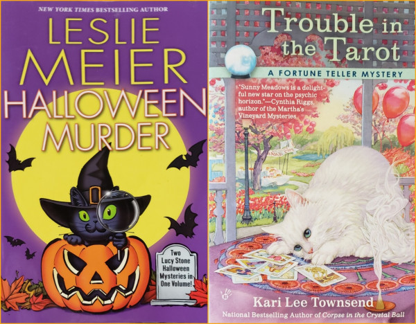 A composite photo of 2 book covers, side by side, with a thin orange border around and separating them. Each features a cat.

On the left is "New York Times Bestselling Author" Leslie Meier's "Halloween Murder," featuring "Two Lucy Stone Halloween Mysteries in One Volume." This cover is a cartoonish illustration, like a greeting card. A cute black cat with large bright green eyes and wearing a pointy black witch hat sits inside a jack-o-lantern. The cat is holding and looking through a magnifying glass. Autumn leaves and a gravestone flank the pumpkin and bats fly around above in front of a giant plain yellow moon set against a purple background.

On the right is "Trouble in the Tarot – A Fortune Teller Mystery" by Kari Lee Townsend, national bestselling author of "Corpse in the Crystal Ball." "Sunny Meadows is s delightful new star on the horizon"—Cynthia Riggs, author of the Martha's Vineyard Mysteries. An elegant white cat with blue eyes and pink nose crouches on an table on a nice outdoor porch overlooking a lovely garden park, as if looking at a scattering of tarot cards there. There are ponds, paths, and old fashioned lamppost, trees, and balloons of pink and blue in the background. A banner for bake-off tables covered with pies nearby. A cone of incense burns near the cat and cards in the foreground.