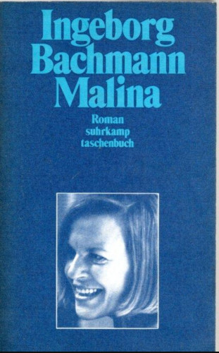 Photo of the book. The cover is dark blue with light blue text at the top: Ingeborg Bachmann, Malina, Roman, suhrkamp, taschenbuch. At the bottom of the cover is a portrait of Bachmann, a smiling white woman with half-long straight hair.
