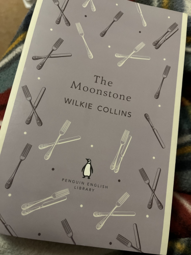 Cover of The Moonstone with multiple items of cutlery depicted on a clear background.