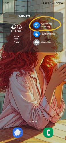 Screenshot of android phone screen with earbuds status & circled text "active noise canceling "
Wallpaper digital art of redheaded woman in pink pj's holding coffee mug & serene expression on her face