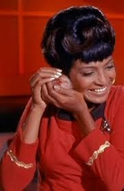 Uhura petting a tribble 