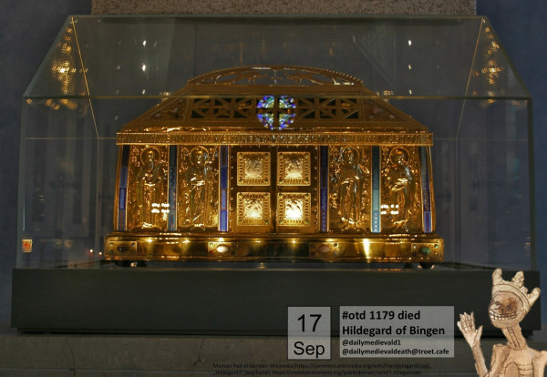 The picture shows a golden reliquary in the shape of a house