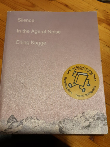 Book cover: about an inch along the bottom is snowy mountain peaks. The rest of the cover is sky, in a pink/light purple colour, suggesting dawn. 