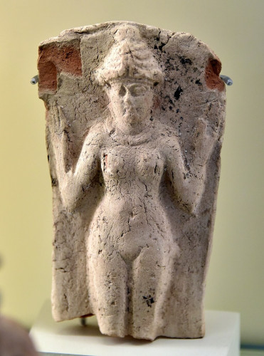 Terracotta plaque, showing the goddess Ishtar or Inanna wearing a horned headdress and a necklace. She is naked, the mons veneris a prominent part of the figure.