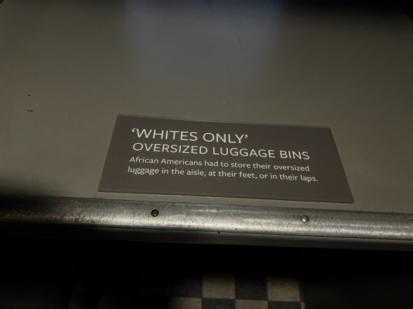 WHITES ONLY OVERSIZED LUGGAGE BINS African Americans had to store their oversized luggage in the aisle, at their feet, or in their laps.