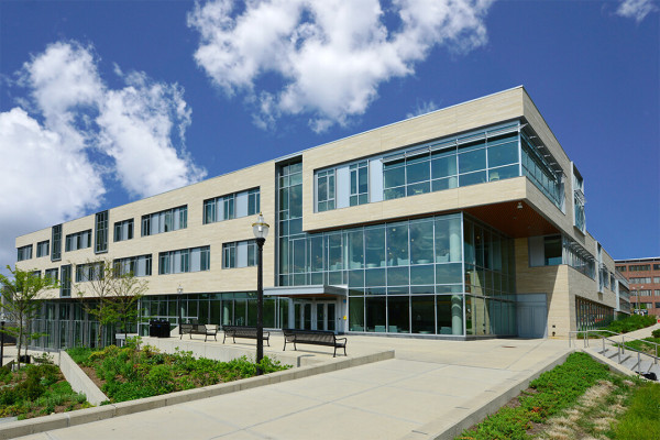 Exterior view of the Integrative Learning Center, where the Journalism Department is housed. The building features multi-floor windows and a jutting contemporary design.