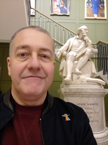 Photograph of myself close to the statue of John Hunter at the Museum of the Royal College of Surgeons, Lincoln's Inn Fields, London.
