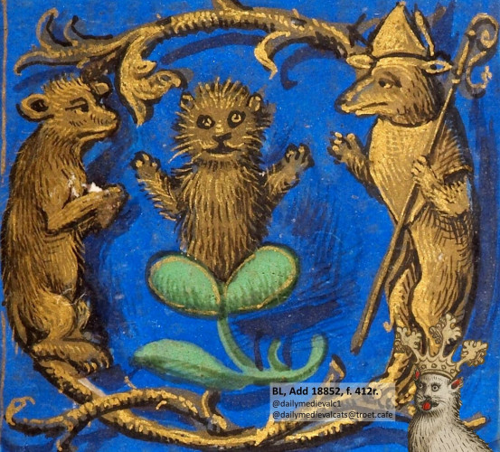Picture from a medieval manuscript: A golden cat being appreciated