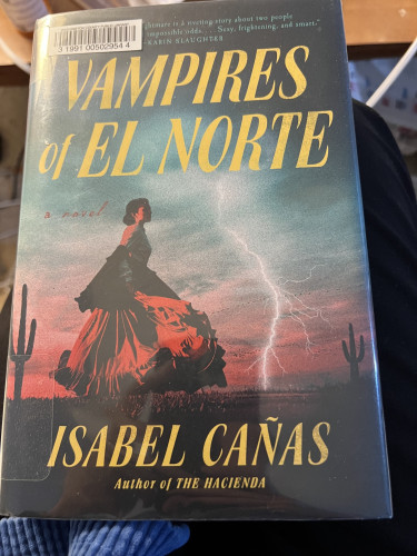 Photo of the novel Vampires of El Norte by Isabel Cañas, checked out from my library. She’s the author of The Hacienda as well.