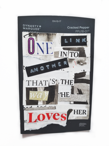A collage of inked paper with cut out words that read "One link into another, that's the way he loves her "