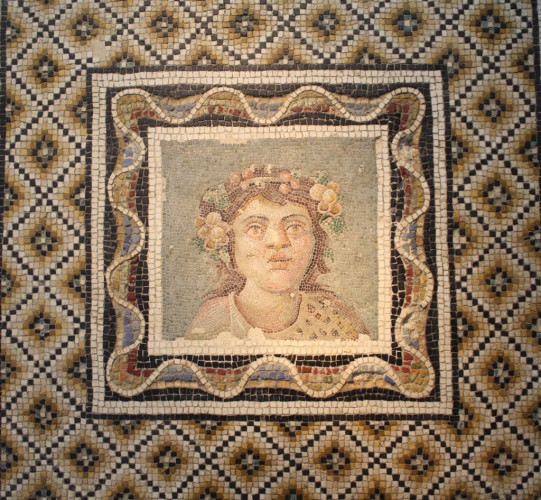Description from World History Encyclopedia: “A 3rd century CE Roman floor mosaic depicting Bacchus, god of wine. From via Flaminia, Rome. (Palazzo Massimo, Rome).” Photograph by Mark Cartwright.