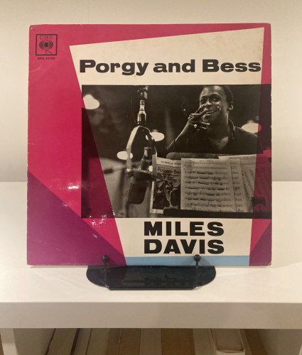 Vinyl record album cover for "Porgy and Bess" by Miles Davis, displayed on a shelf.