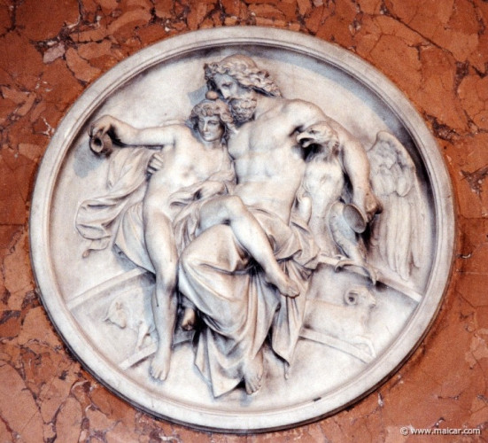 Circular relief depicting Zeus seated with one arm around his eagle and the other around Ganymedes, who seems to just slip off his lap, holding a little jug. In the background, decorations of a bull and a ram can be seen.