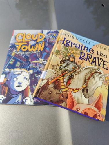 Cloud Town and Igraine the Brave books stacked together.