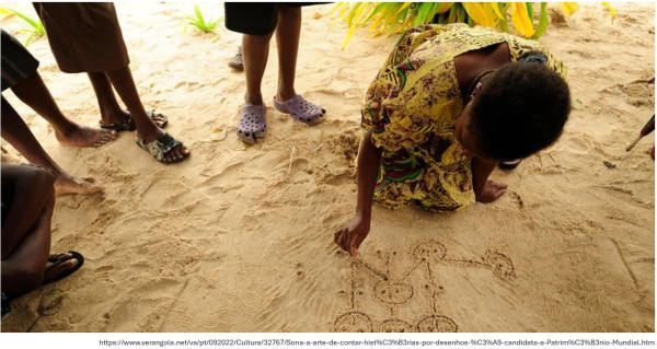 A group of black children playing. One of the children, a girl in a colourful dress, is drawing a diagram on the sand floor. The other children's legs and feet are visible, some wearing rubber flip-flops and others barefoot. 