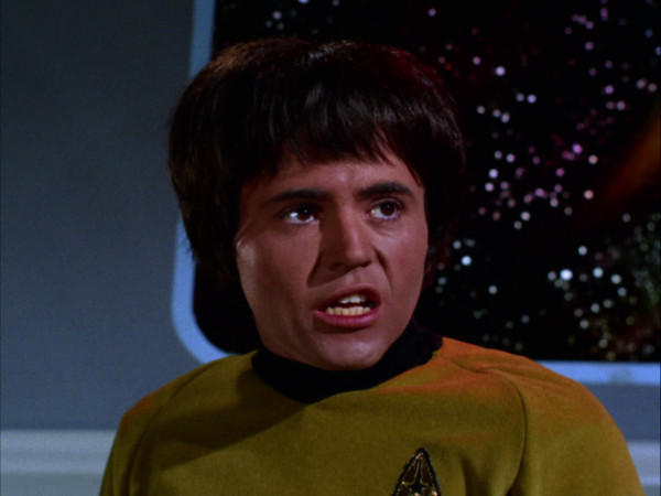 Lieutenant Chekov sports a (raised?) bowl haircut, and is speaking.