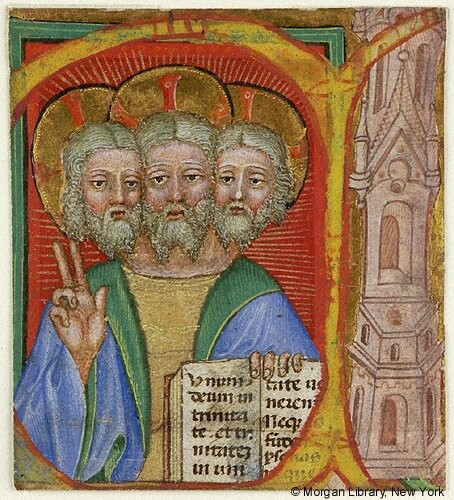 A medieval book illustration from the 15th century. A male figure is standing frontally, visible from the waist upwards. It has three heads which all look similar: light-colored long hair and beard, and a halo with cross sign. The figure holds a book in his left hand, the right hand is raised in a blessing gesture. It’s depicting God/Jesus/The Holy Trinity.