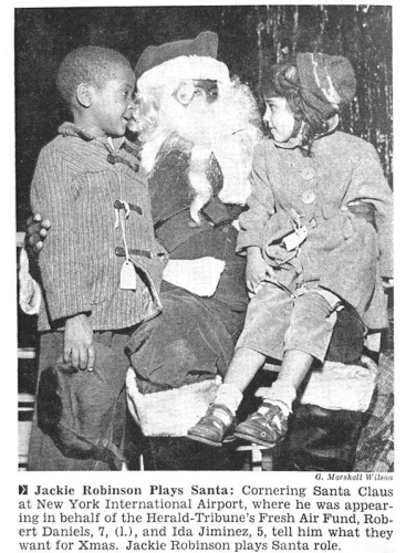 "Jackie Robinson Plays Santa: Cornering Santa Claus at New York International Airport, where he was appearing on behalf of the Herald-Tribune's Fresh Air Fund, Robert Daniels, 7, and Ida Jiminez, 5, tell him what they want for Xmas. Jackie Robinson plays Santa role."

Jet Magazine published December 31, 1959.

Jackie Robinson was Santa the same year MLB playing rosters were finally desegregated to the bare minimum. 