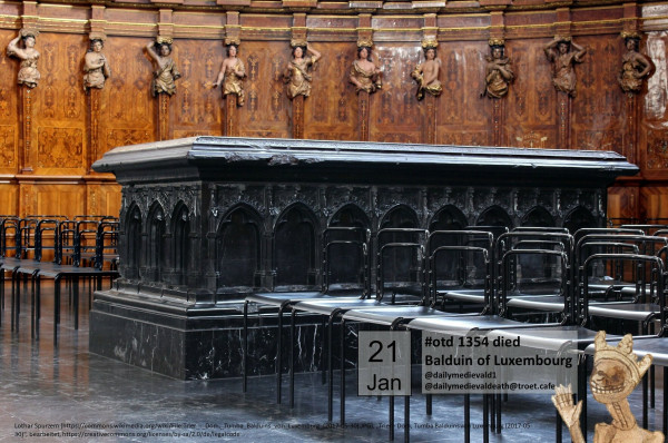 The picture shows a high tomb made of black marble.