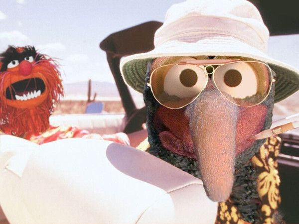 A scene from the movie Fear and Loathing in Las Vegas, where Raoul and Dr. Gonzo are in the front seats of a convertible looking back toward the photographer, but with Raoul and the doctor replaced by Animal and Gonzo (the Muppets) respectively