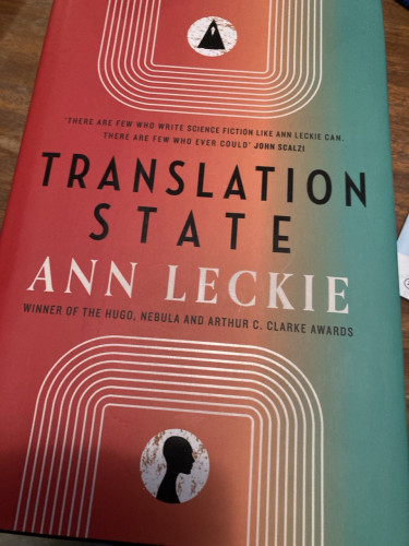 The cover of Translation State. Red fading to green on the vertical. 
