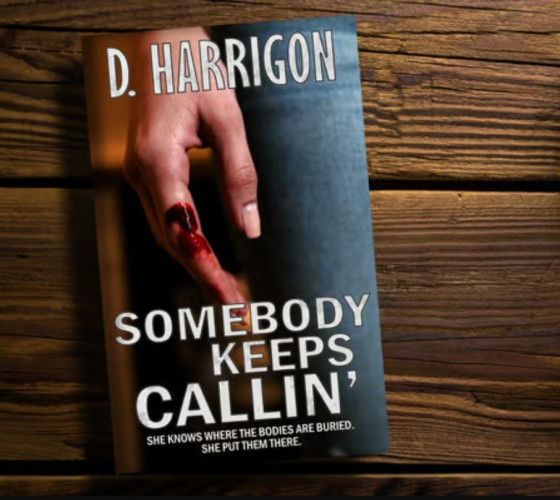 The cover art for Somebody Keeps Callin' against a dark, wood tabletop, features a woman's hand with a spot of blood.