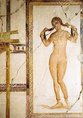 Fresco of Venus of the Aphrodite Anadyomene type. Venus emerges from the sea or from the bath, wringing out her wet hair. She is in the nude but adorned with a necklace, arm rings, bracelets and anklets.
