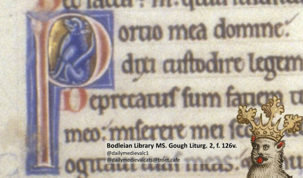 Picture from a medieval manuscript: A blue cat crouches in a P initial.