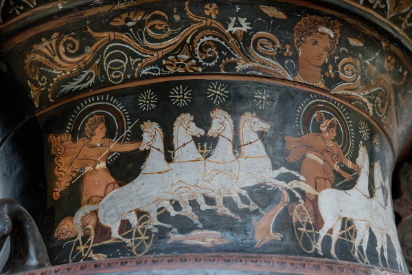 The chariots of Helios and Selene are depicted, beneath which the fishes symbolize the Ocean in which Their daily, or nightly, journeys begin and end.