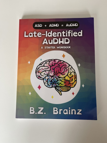 Late-Identified AuDHD: A Started Workbook on a white table