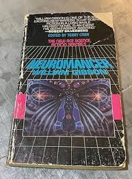 A really beat up trade paperback copy of "Neuromancer" by William Gibson. I had this edition for many years and it was similarly ravaged. The cover has weird purplish butterfly with star eyes on its wings over a sort of wire frame space grid. 