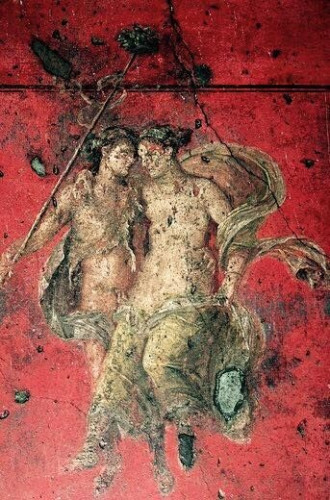Fresco of Dionysos and Ariadne arm in arm against a bright red background.