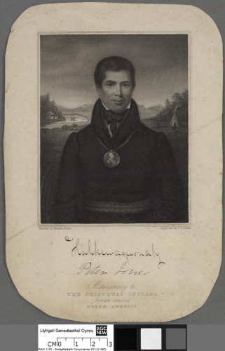 A fine engraving of Peter Jones's portrait produced by his wife, Matilda Jones. His dual Welsh and Ojibwe ancestry is made visible in his personal appearance, arrangement of the background and his two names carefully signed below the portrait. He stands before a silvan Canadian landscape complete with mountains, a log cabin by a river to his left and a tippee outside a forest to his right. With a neat Western haircut and typical attire of a Wesleyan man of the cloth and wearing a medallion around his neck, Peter is the picture of Methodist respectability. He wears a slight smile on his lips. 