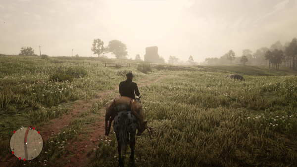 A screenshot from Red Dead Redemption 2 showing a cowboy riding a horse and carrying a deer through a beautiful scenery of fields.
