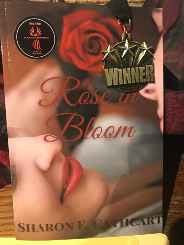 Rose in Bloom book cover with award sticker and medal