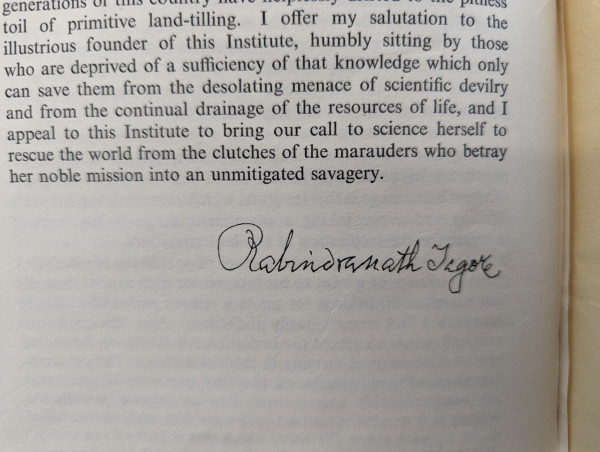 A photograph of some printed text in a book, followed by what looks like a handwritten signature for Rabindranath Tagore. 